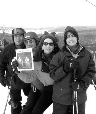 03-01-01
Mattapoisett residents Jeff and Karen Swift and Michael and Sandy King take time out from a busy day of skiing to pose with a copy of The Wanderer atop Pleasant Mountain (a/k/a Shawnee Peak Ski Area) overlooking Mount Washington during the recent February school vacation week. The two couples traveled with Caitlin and Jarod Swift, Kristen Searles, and Andrew and Matt King  all of whom were unavailable for the photo due to a much-needed hot chocolate break. 3/1/01 edition
