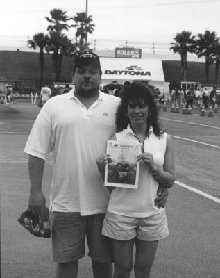 03-08-01
Stephen Gendron and Cheryl Souza pose with a copy of The Wanderer at the Daytona 500 which they attended last month on February 18 with friends Lauren and Doug Lemieux. One of the premier auto racing events in the world, this years event unfortunately claimed the life of seven-time champion Dale Earnhardt, whose team member Michael Waltrip went on to bittersweet victory. 3/8/01 edition
