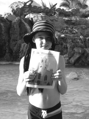 032504
The Ellis family of Mattapoisett recently took a week respite and managed to bring a copy of their favorite paper with them during February school vacation in the Turks and Caicos islands. This island chain in the West Indies is where Columbus first landed when he was traveling to the New World. Pictured here is Brad Ellis with a copy of The Wanderer in front of one of the waterfall pools at Beaches Resort in Turks and Caicos. (Photo by Pam Ellis, courtesy of Ron Ellis). 3/25/04 edition
