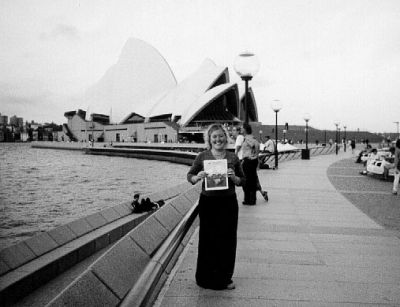 04-05-01
Adrienne Boutin of Rochester poses with a copy of The Wanderer in front of the famous Opera House in Sydney, Australia. Ms. Boutin is currently spending a semester down under as part of her schools exchange program. 4/5/01 edition

