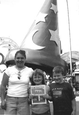 041703-4
During a family trip to Walt Disney World in October, 2002, these Wandering Wanderers posed with a copy of their favorite local newspaper at the Magic Kingdom. Pictured here (l. to r.) are Michelle Barrows, Shannon Davis, and Jason Davis. (Photo courtesy of Glenn and Cathy Davis). 4/17/03 edition
