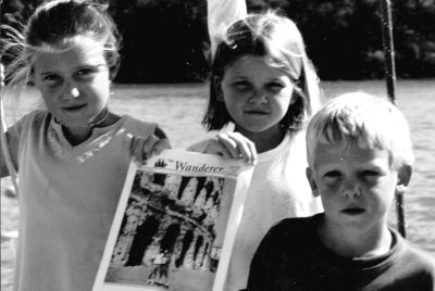 05-23-02-6
 (l. to r.) Christina, Caroline and Luke Johns of Mattapoisett pose with a copy of The Wanderer aboard their boat Mergalo while spending six months recently in the Caribbean. This was taken just off the Island of Grenada by dad, David Johns. 5/23/02 edition
