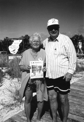 051503-4
Dorothy and Ed Lewis of Mattapoisett pose with a copy of The Wanderer on Little Water Cay (Iguana Island) during a recent trip to Turks and Caicos Islands in the British West Indies. 5/15/03 edition
