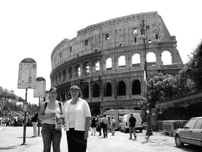 061704
George Landry of Rochester sent along a picture of his daughter and wife during a recent visit to Rome earlier this month. Here they are seen posing with The Wanderer outside the remains of the Roman Coliseum. Pictured are Kristen Landry and Sheila Landry, both of Rochester. (Photo courtesy of George Landry). 6/17/04 edition
