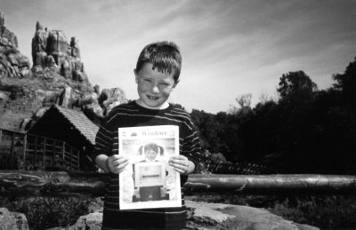 062404-4
Tanner Studley of Mattapoisett poses with a copy of The Wanderer at the entrance to Thunder Mountain in Disney World during a recent trip with his family over the April school vacation. 6/24/04 edition
