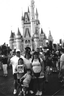 062404-5
Posing with a copy of The Wanderer at Disneys Magic Kingdom are (back row) Jay Sullivan, Barbara Sullivan, David Ellis, (front row) Sophia-Lynn Ellis, Samuel Ellis, and Cheryl Ellis. 6/24/04 edition
