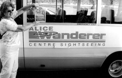 080703
No, this isnt the tour bus which takes your around our Mattapoisett office. Melinda Kershaw of Rochester is posing with a copy of The Wanderer in front of a Wanderer tour bus while on vacation recently in Alice Springs, Australia. (Photo courtesy of Melinda Kershaw). 8/7/03 edition
