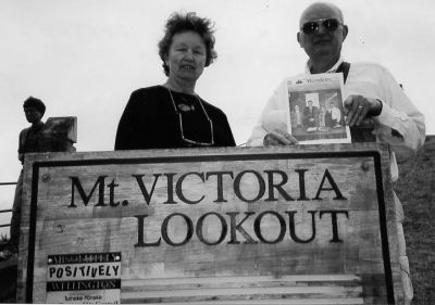 121803-5
Robert and Carol Cattley of Water Street in Mattapoisett recently took a trip to Wellington, New Zealand. They are seen posing here at the scenic Mount Victoria Lookout with a copy of Mattapoisetts own The Wanderer. (Photo courtesy of Robert and Carol Cattley). 12/18/03 edition

