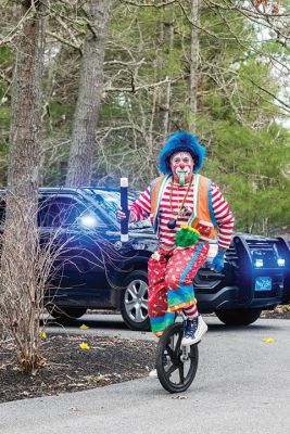 Birthday Surprise
Skipp the Clown leads a parade of supporters up the driveway of Rochester resident Rowan Farquharson, whose sixth birthday was made special despite the limitations he lives with due to mysterious allergic reactions and a compromised immune system. Photo by Ryan Feeney - May 7, 2020 edition
