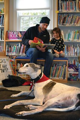 Amos, the reading greyhound
Amos, the reading greyhound, is now at home at the Plumb Library after over a year as Rochester’s newest literate dog. On Saturday, Autumn Simmons and her Dad Matt read several of Autumn’s favorite books to Amos who listened attentively, took a nap, and gave a thank you hug before leaving. Photos by Jean Perry
