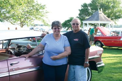 Car Show
Joyce Andrade, left, and Jordan Andrade, right, pose in front of their 1958 Chevy Impala. The couple purchased the car in 1999, and with the help of their son, they restored the antique vehicle to its former glory. The Andrade family was among the many car enthusiasts that attended the 2009 Mattapoisett Heritage Days car show. Photo by Anne O'Brien-Kakley
