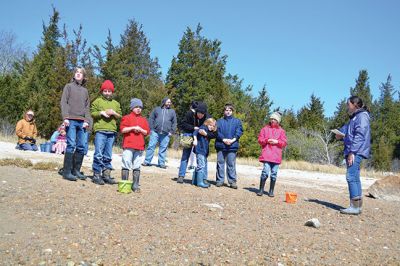 Buzzards Bay Coalition
One of the educational events the Buzzards Bay Coalition had planned for April vacation brought kids to the 6.1-acre property to explore the marshy beach for a scavenger hunt. The osprey from a nearby nest kept a close eye on the group until the treasures were tallied and the group waded back down the mud-puddled path to the road. Photo by Jean Perry

