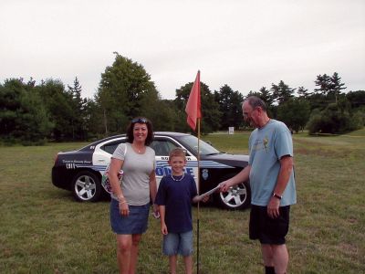Ball Drop
The Rochester Police Brotherhood conducted a golf ball drop fundraiser at the Rochester Country Fair on August 21, 2010. First place went to 9-year-old Connor Walsh of Marion. Sgt. Bill Chamberlain of the Brotherhood presented Connor with his winnings after the ball drop. Photo courtesy of Bill Chamberlain.
