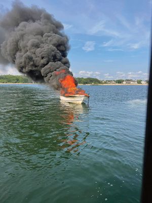 Boat Fire
All passengers escaped without harm after a small boat in Aucoot Cove was swallowed up in flames on July 1. Marion M225 responded to the boat fire, and activation of the Buzzards Bay Task Force followed. Marion Assistant Harbormaster David Wilson can be seen dousing the flames with assistance from the Mattapoisett, New Bedford and Wareham fire departments, Mattapoisett Harbormaster and New Bedford Police. Photos courtesy Marion Fire Department
