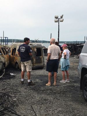 Mattapoisett Boatyard Fire
Smoke rose over Mattapoisett Harbor on August 19 after a boat caught fire during the replacement of a gasoline tank. An explosion followed by a raging fire leveled Mattapoisett Boatyard and destroyed the 14 boats and 47 vehicles on site. Members of the Kaiser family who own the business and members of the McLean family who founded the business surveyed the ruins on the weekend and vow to rebuild. Photos by Marilou Newell and courtesy of Mattapoisett Police and Fire departments and Kathleen Costello
