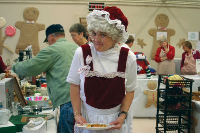 Mrs. Claus
Candyland Faire Fun - the rain didnt stop Holiday-minded buyers from attending the Mattapoisett Congregational Churchs Candyland Faire on November 14, 2009. It was standing-room only as people browsed through tables of hand-knitted sweaters, fudge, baked goods, festive dishes and more. Even Mrs. Claus took a break from her busy schedule to attend! Photos by Anne OBrien-Kakley. November 19, 2009 edition

