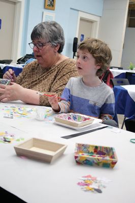 Create & Connectivity
As part of Art Week, the Marion Art Center joined the Council on Aging on Saturday morning, May 4, for a seniors and children’s “Create & Connectivity” event at the Benjamin D. Cushing Community Center. Participants of all ages used colorful paper cuts and glue to decoupage small wooden trays. Photos by Jean Perry
