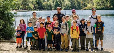 Gine Fishing
Rochester Scout Pack 30 had a fishing day at Five Mile Pond at Camp Cachelot in Myles Standish State Forest on September 27. The Cub Scouts were being trained in the art of fishing, tying knots for their hooks, as well as baiting a hook. Joshua Ernstzen, 7, (middle right) was the first Cub Scout to catch a fish. Photos by Denzil Ernstzen
