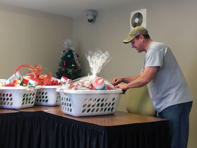 Christmas Baskets
On Tuesday, December 20, Rochester Facilities Manager Andrew Daniel was tying perfect Christmas bows to top off gift baskets for Rochester families purchased with donations from Town Hall staff and town boards and committees. Four families this year will receive a Christmas meal in a basket thanks to the efforts of all at Town Hall. Altogether $1,400 was raised at Town Hall, with half going to the gift baskets and the other half towards other town Christmas charities. Photos by Jean Perry
