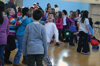 Manguito
Center School students were introduced to Latin rhythms and percussion instruments by the Boston-based educational Latin American music group Manguito during an afternoon presentation on January 24. Manguito members really captured the attention of the kids, resulting in plenty of learning while the group’s sizzling salsa and merengue music resulted in an eruption of dancing and spontaneous conga lines. Photo by Jean Perry
