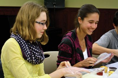 Cupcake Decorating
Joey Appleton (left) and Sienna Wurl (right) set up their piping bags during the holiday cupcake decoratiing activity held by the Mattapoisett Free Public Library on Wednesday, December 5.  Photo by Eric Tripoli.
