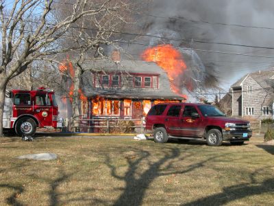 Fatal Fire
A devastating house fire at 13 Briar Road in the Point Connett area of Mattapoisett claimed the life of the sole occupant, 72-year-old Carlton Cook, on Sunday afternoon, February 3. (Photo by Paul Lopes).
