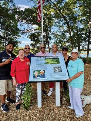 DePina Landing
Members of the public and the DePina family gather around a new commemorative plaque at the rededication ceremony for DePina Landing on Wednesday, August 14. Photo by Robert Pina
