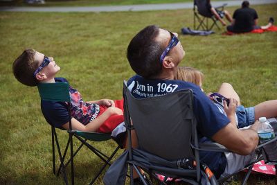 Partial Eclipse, Total Excitement 
The Plumb Library welcomed celestial spectators on Monday for the region’s partial eclipse of the sun, handing out free eclipse glasses. Photos by Glenn C. Silva
