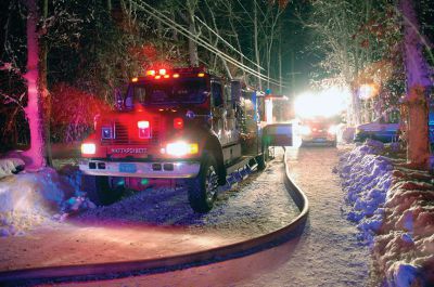 Crystal Springs Fire
The Mattapoisett Fire Department responded to a structure fire on Sunday evening. Hampered by the snow and ice they chased the fire through the walls and roof of the house and were eventually able to gain control. The house sustaining significant damage and one firefighter was injured during the incident. Photos by Charles Hutchison, Artisan Ingenuity Photo
