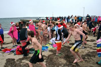 Christmas Day Swim
Helping Hands and Hooves hosed their 11th annual Christmas Day Swim at 11:00 am at the Mattapoisett Town Beach. Helping Hands and Hooves is a non-profit (based in Mattapoisett) that is dedicated to providing therapeutic horseback riding lessons for adults with disabilities. If you would like to learn more about Helping Hands and Hooves you can visit their website at www.helpinghandsandhooves.org. Photo by Robert Chiarito
