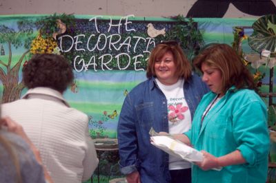 Habitat for Humanity Home and Garden Show
Sue McCarthy (center) and Donna Sherman (right), who own The Decorative Garden out of Dartmouth, speak to patrons of the Habitat For Humanity Home and Garden Show. 
