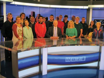 Intro to TV  Production
As a culminating activity, Old Rochester Regional High School students in Intro to TV  Production, Video Journalism and Bulldog TV, traveled to Boston to view a live  broadcast of the noon news at WBZ-TV, a CBS affiliate. Mike Noyce, set designer at WBZ  led the group on a tour of the facility. Students were able to view the live broadcast of the news both from the control room and in the studio. After the newscast, anchor Paula Ebben and Meteorologist Barry Burbank fielded questions from the group.
