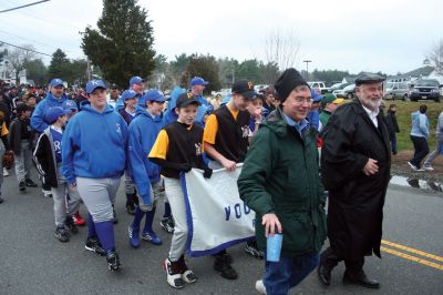Opening Day
The Rochester Youth Baseball League held their annual opening day ceremony and parade on Saturday, April 11. About 400 people, including players, coaches and their families, participated in the procession that made its way down Route 105 to Gifford Parks Al Herbert Memorial Field for the opening day festivies. Photo by Robert Chiarito.
