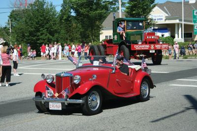 4th of July Parade
The Sun finally broke through the clouds to help make for a glorious Tri-Town Fourth of July weekend highlighted by Marion's annual Independence Day Parade, hosted by the Benjamin D. Cushing Post 2425 Veterans of Foreign Wars. Parade goers lined the streets of Marion Village as floats, antique vehicles, bands, and emergency vehicles made their way along the parade route this past Saturday morning. Photo by Robert Chiarito.
