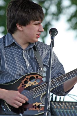 Shipyard Concert
Singer/Guitarist Bill Mulligan accompanied by Scott Bissonette played a free concert for about 100 people at Mattapoisett's Shipyard park gazebo as part of the Seaport Village Summer Concert series on Saturday evening, July 11. Many families made an evening of the event, bringing picnic suppers to eat as they enjoyed the music. Photo by Robert Chiarito.
