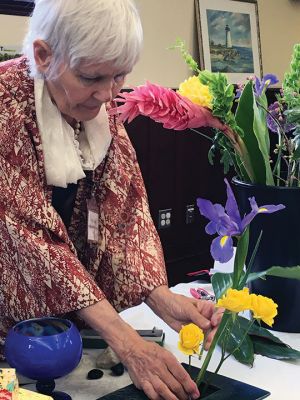 Ikebana
Mattapoisett resident Ellen Flynn gave an Ikebana flower arranging demonstration at the public library on May 5. This type of flower arranging began in 7th century Japan, and Flynn has studied the art form for over 15 years. Reading from a centuries-old verse about Ikebana, Flynn shared that this art form is “like a poem, or a painting.” Photos by Marilou Newell
