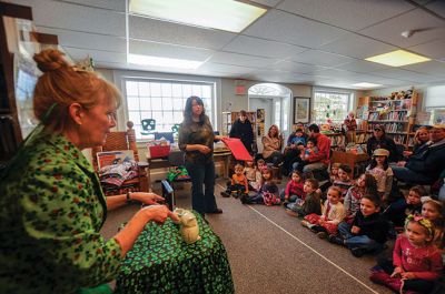 Irish Fairy Godmother
Bringing with her a magical teapot, the Irish Fairy Godmother visited the Joseph H. Plumb Memorial Library March 7, treating about 25 kids to a magic show. Magician Debbie O’Carroll said her favorite part about being the Irish Fairy Godmother is seeing the cheerful responses from her young audience. Photos by Felix Perez
