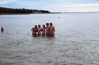 Keep on Plungin’ 
The annual Keep on Plungin’ New Year’s Day swim drew well over 100 participants to Mattapoisett Town Beach, continuing a tradition started in 2013 by Will and Michelle Huggins to help families facing expenses related to cancer care. In the last two years, the community-driven effort has benefitted three families and Dana Farber with a $1,000 donation in Huggins’ honor. This year, organizers anticipate supporting at least two more families with checks for $2,000. Photos by Mick Colageo
