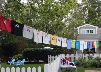 Mattapoisett Road Race
For years, the Kassabian family has inspired competitors in the Mattapoisett 5 Mile Road Race by hanging official race T-shirts of the past in front of their Church Street home along the racecourse. Courtesy of Laurie Kassabian

