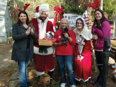 It’s All About the Animals 
On Sunday, November 11, It’s All About the Animals in Rochester held a holiday open house and craft sale to benefit the non-profit organization.  The organization helps abandoned cats and small dogs find homes throughout Massachusetts.  From left: Chantelle Pavao, Santa Claus, Pam Robinson, Mrs. Claus and Nikki Horton.  Photo by Katy Fitzpatrick

