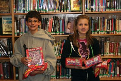 Lollipop Math
Two of the three students involved in the DumDum lollipop project, Samuel Resendes and Emily Wheeler, pose with their lollipops in the library at ORR. Photo by Sarah K. Taylor. 
