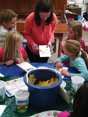 Marion Natural History Museum
Artist/Naturalist/Educator Patricia Cassidy gives the Marion Natural History Museum after-school group some tips for creating their own scientific illustrations. Cassidy showed students examples of her own works, then students created their own pieces. Many of these wonderful works may be seen on the Museum's Facebook page and website at www.marionmuseum.org. Many thanks to Ms. Cassidy for sharing her talent with us! Photo courtesy of Elizabeth Liedhold
