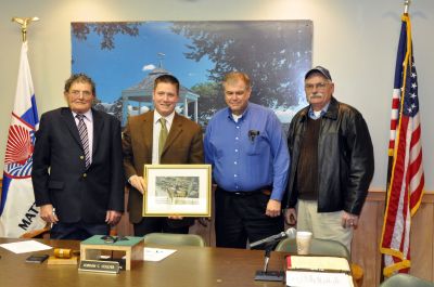 Presentation to Selectmen
Members of the Mattapoisett Historical Commission and the Heritage Days Committee present an aerial photo of the closing day ceremonies of the 150th Aniversary Celebration.  Left to right: Selectman George Randall, Selectman Jordan Collyer, Aerial Photographer Ken Howland of South Dartmouth and Pilot John Williams of Wareham.  The pilot and photographer team graciously donated their time and flight cost in capturing this moment in Mattapoisett's history. (Photo by Tim Smith)


