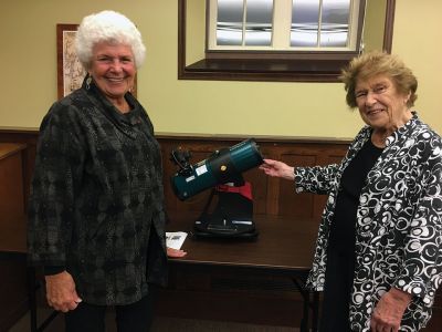 Friends of the Mattapoisett Library
On October 11, the Friends of the Mattapoisett Library unveiled their latest gift to the library -- a telescope. Partnering with the Aldrich Astronomical Society, the telescope was purchased at a discounted rate. From left to right: Rayna Caplan, who worked on the acquisition, and Jo Pannell, who championed the purchase. The telescope will be available to card-carrying library members soon. Photo by Marilou Newell
