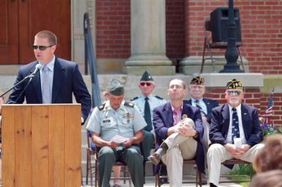 Mattapoisett’s Memorial Day
Board of Selectmen member Jordan Collyer (left) spoke during Mattapoisett’s Memorial Day celebration on May 28, 2012.  Collyer told the story of how he was able to spend a night aboard the same ship his grandfather served on during World War II. Photo by Eric Tripoli.

