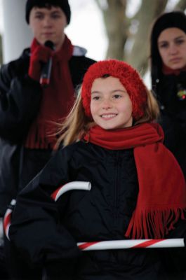 Santa Arrives
Mattapoisett held its annual holiday celebration and tree lighting on Saturday, December 5, 2009 at Shipyard Park. The rain couldn't dampen holiday spirits as visitors enjoyed delicious food and listened to Christmas music performed by the Showstoppers. Children made their own ornaments and hung them on the Christmas tree. They also danced with Rudolph and Frosty and shared their Christmas wishes with Santa Claus. Photo by Felix Perez.
