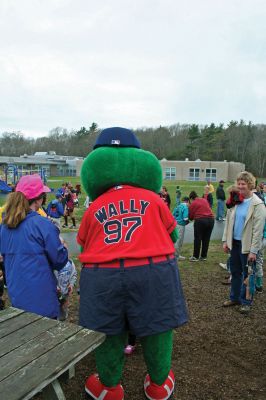 Opening Day
The Mattapoisett Youth Baseball League opened their 2009 season with a parade down Route Six on Saturday morning, May 2. Special guest and Boston Red Sox mascot Wally the Green Monster was on hand to throw out the first pitch and sign autographs for the young players. Photo by Robert Chiarito.
