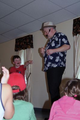 Minecraft Magician 
It was all about “Building a Better World” on August 14 during a children’s performance sponsored by the Plumb Library and the Rochester Cultural Council. Performer “Jungle Jim” Manning merged Minecraft with magic and built a blast of a time with the kids. Photos by Jean Perry
