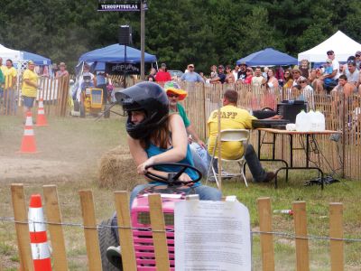 Mower Fun
Lindsey Harding, of Acushnet, took First Place in the Lawnmower Race at the Rochester Country Fair. Photo by Adam Silva.
