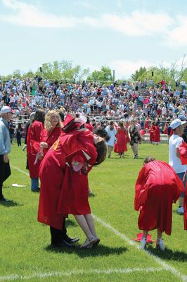 Old Rochester Regional High School graduates toss their caps high into the air at the conclusion of Saturday's graduation exercises on the Mattapoisett campus. A beautiful Saturday afternoon greeted families, friends and supporters of the Class of 2022, which was led in the procession by Valedictorian Amaya McLeod, Class President Mackenzie Marie Wilson, Class Vice President John Joseph Kassabian and Class Treasurer Eddie Gonet. Photo by Mick Colageo
